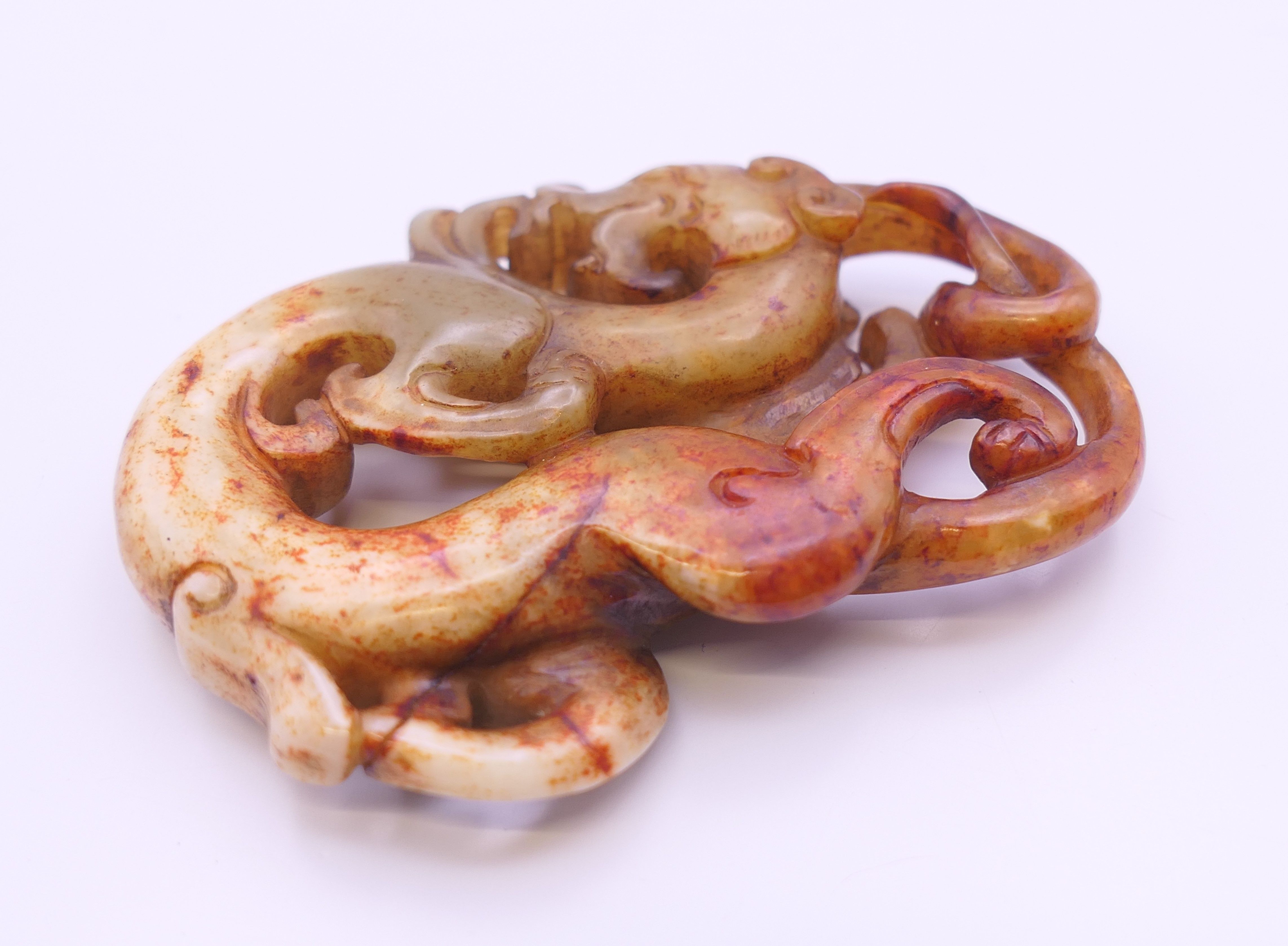 A Chinese white, yellow, green and red jade dragon pendant, Han Dynasty. 7 cm high. - Image 3 of 4