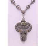 An Art Deco silver pendant necklace. 36 cm long, pendant 5.5 cm high.