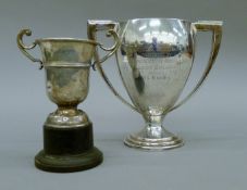 Two silver trophy cups. The largest 17 cm high. 13.8 troy ounces.
