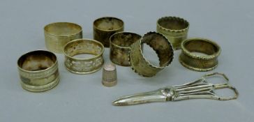 A quantity of silver and silver plated napkin rings, grape scissors, etc. 103.3 grammes of silver.