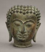 A bronze bust of Buddha. 13.5 cm high.