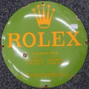 A Rolex enamel sign. 29 cm diameter.