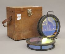 Two boxed photographic lenses.