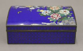 An early 20th century Japanese sky blue ground cloisonne box with domed lid decorated with flowers,