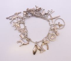 A silver charm bracelet. 48.9 grammes.