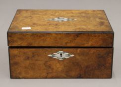 A Victorian walnut work box. 29.5 cm wide.