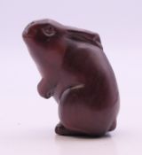 A netsuke formed as a rabbit. 5 cm high.