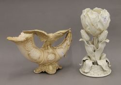 A Belleek vase and a Continental blush ivory vase decorated with an eagle. The former 32.5 cm high.