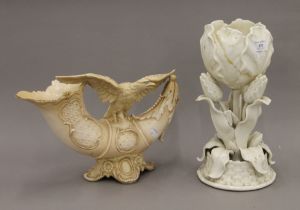 A Belleek vase and a Continental blush ivory vase decorated with an eagle. The former 32.5 cm high.