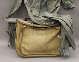 Two vintage USAF flight bags and a flight suit. The former each approximately 65 cm wide.