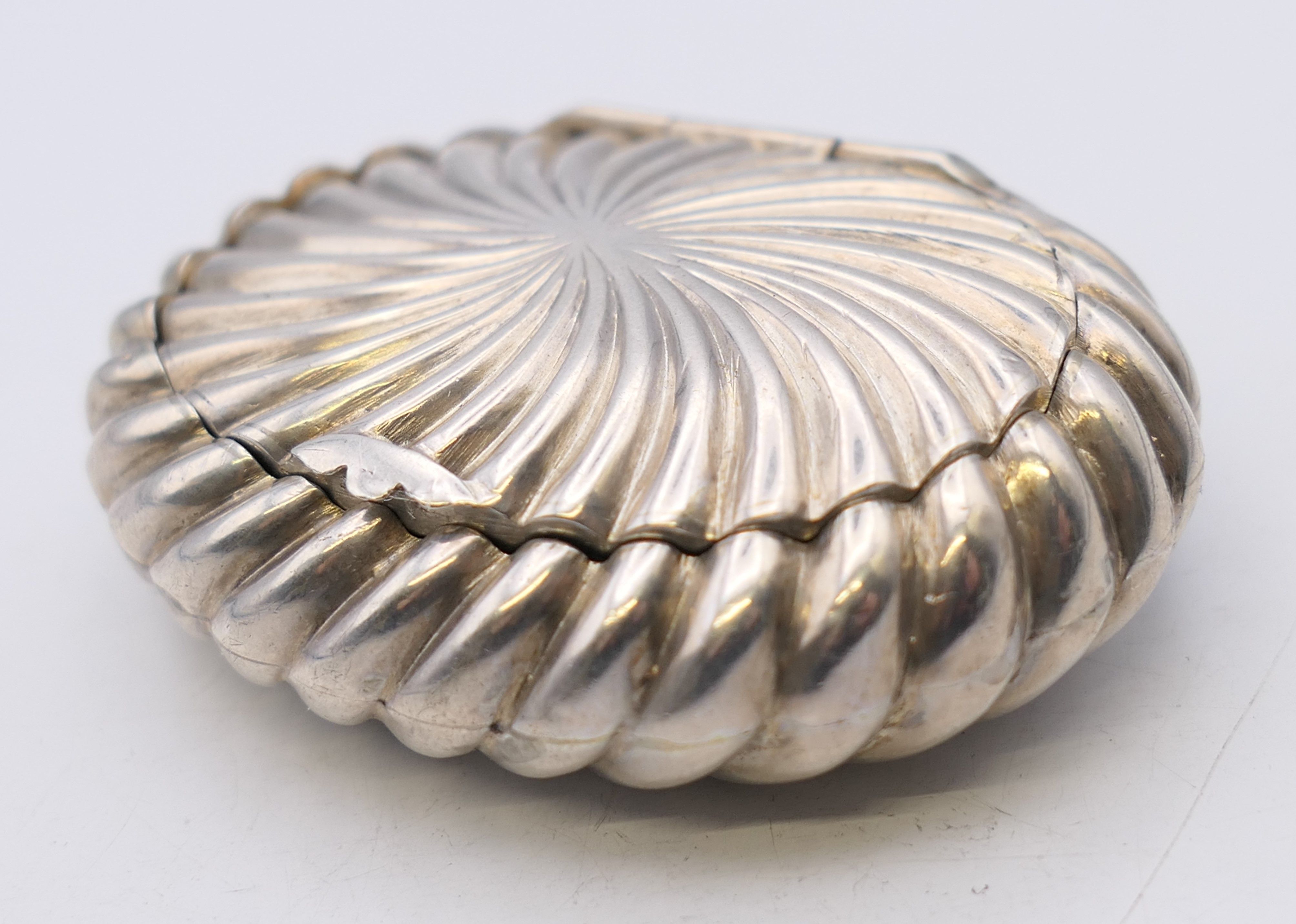 A silver snuff box, hallmarked for Birmingham 1890. 6 cm x 4.5 cm. 20 grammes.