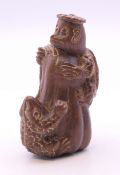 A netsuke formed as a tortoise and a toad. 6 cm high.