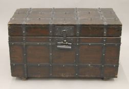 A n Eastern iron bound wooden chest. 68 cm long.
