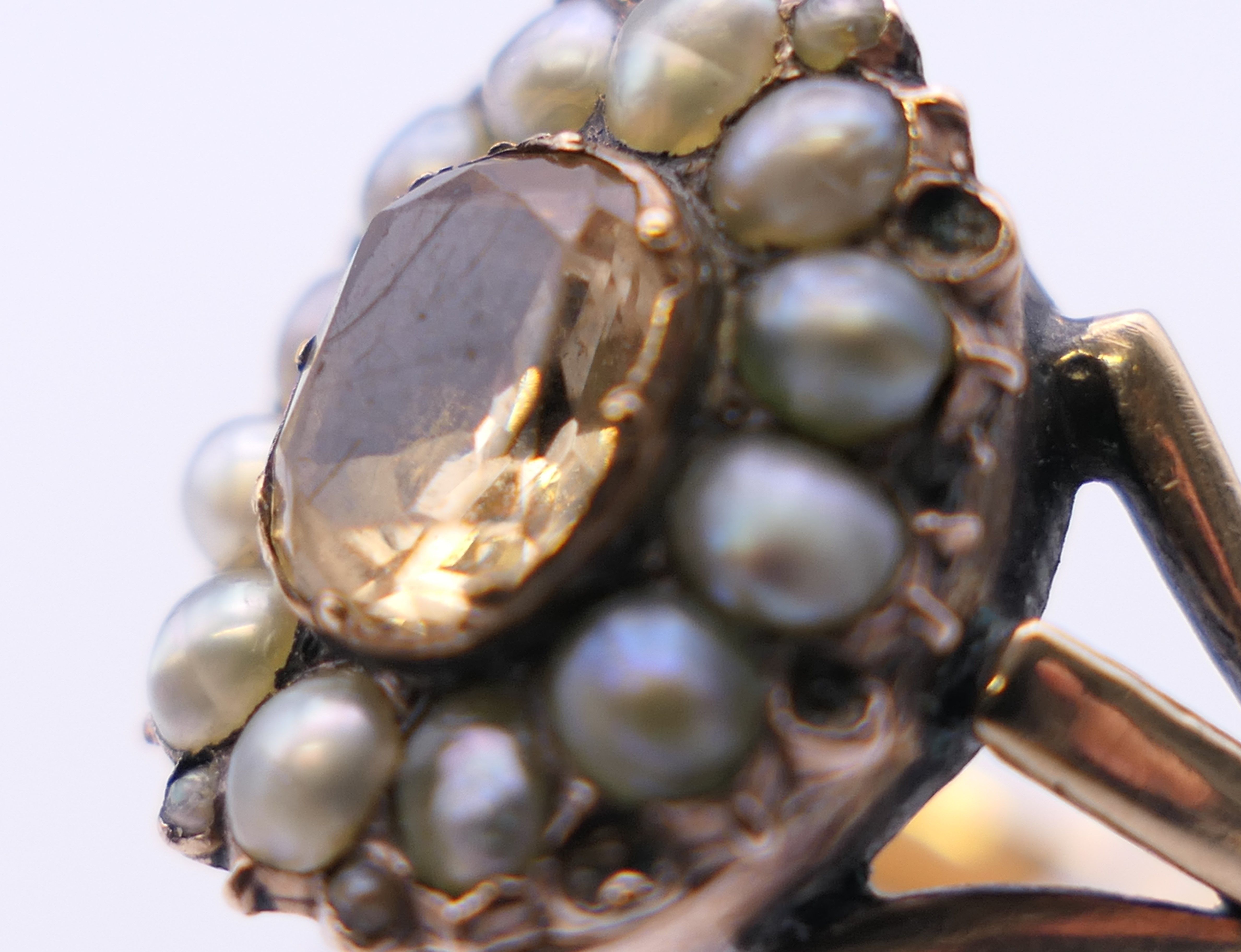 An antique unmarked gold Imperial topaz and seed pearl ring. Ring size N/O. 5. - Image 5 of 5
