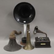 A quantity of radio horns with a small gramophone. The largest 62 cm high.