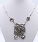 An Art Nouveau style silver pendant necklace. Pendant 6 cm high.