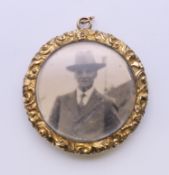 An antique locket. 3 cm diameter.