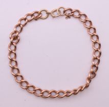 A 9 ct rose gold bracelet with associated clasp and link. 20 cm long. 15.6 grammes.