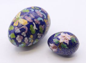 Two cloisonne eggs. The largest 6.5 cm high.