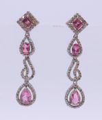 A pair of diamond and pink tourmaline drop earrings. 4.5 cm high.