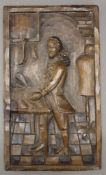 A wooden panel carved with a tailor. 22.5 x 39 cm.
