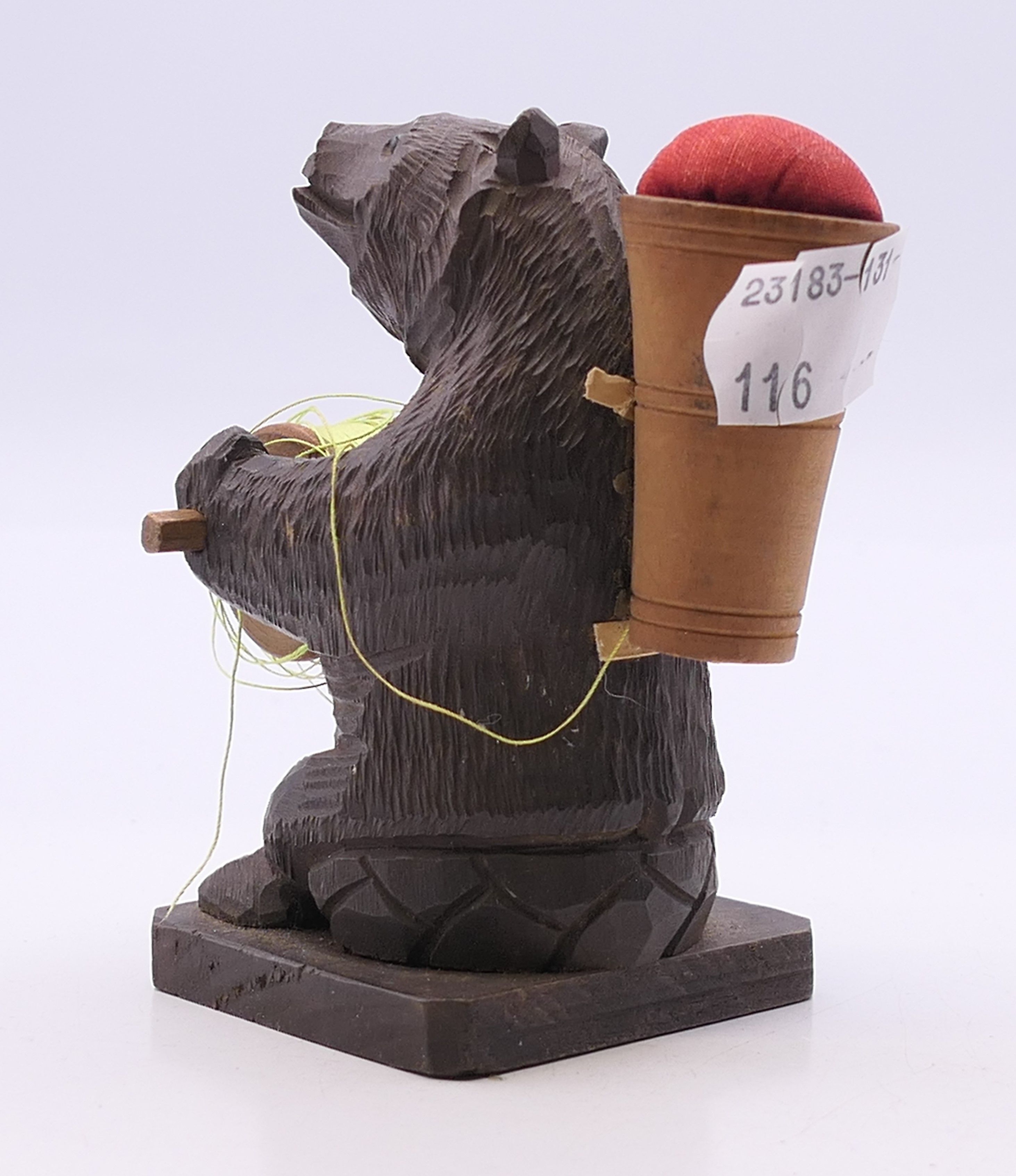 A Blackforest cotton reel holder and pin cushion formed as a bear. 9 cm high. - Image 2 of 3