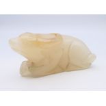 A Chinese white jade recumbent water buffalo, late Qing Dynasty or after. 7 cm long.