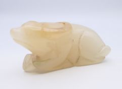 A Chinese white jade recumbent water buffalo, late Qing Dynasty or after. 7 cm long.