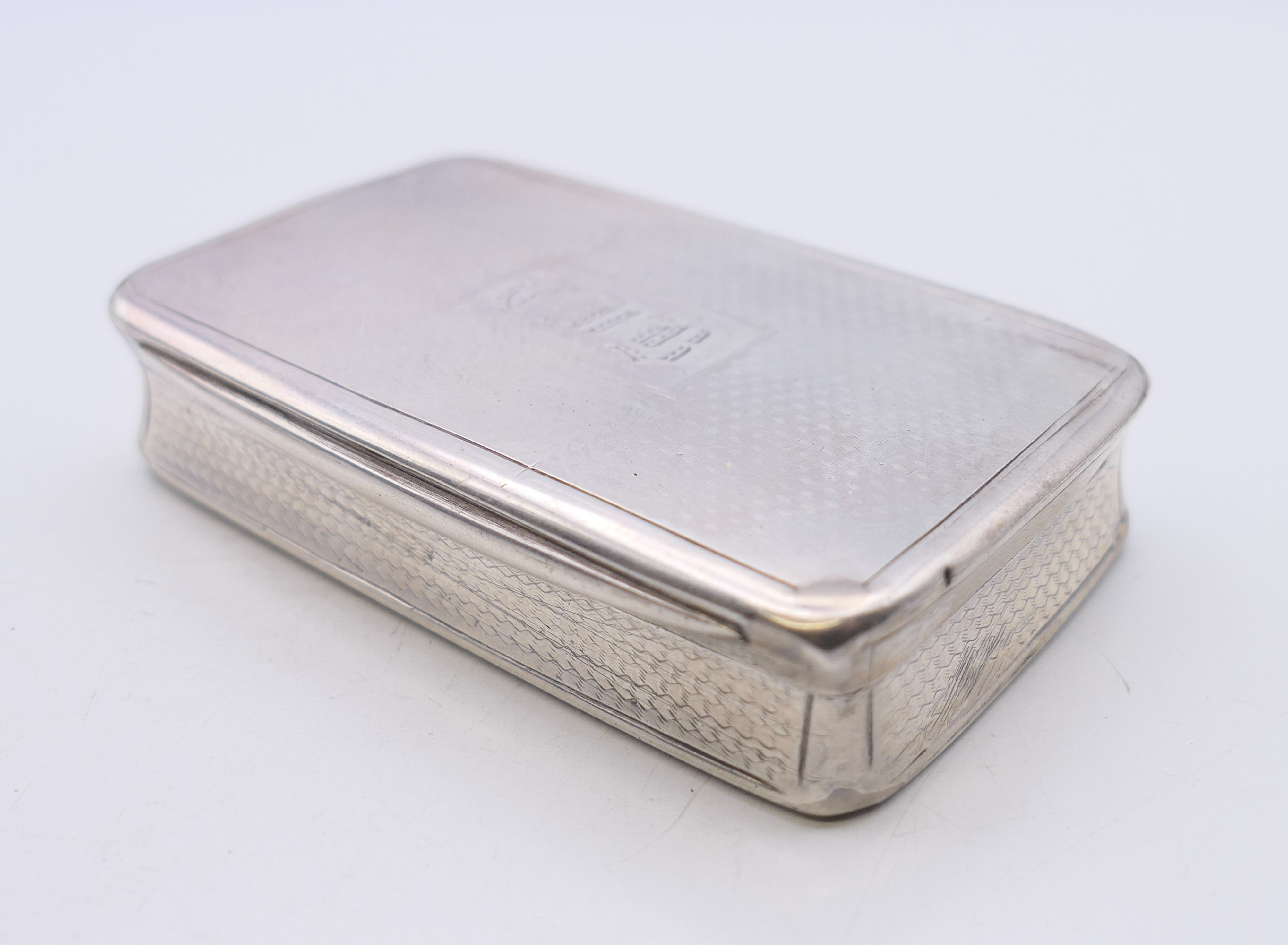 A silver snuff box, hallmarked for Birmingham 1869, maker's mark of George Unite. 7.5 cm x 4.5 cm.