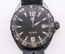 A Tag Heuer Formula 1 gentleman's wristwatch. 4 cm wide.