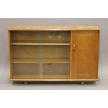 An Ercol side cabinet. 135 cm wide.