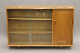 An Ercol side cabinet. 135 cm wide.