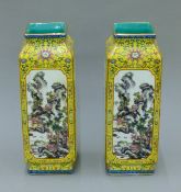 A pair of Chinese yellow ground porcelain square vases. 30 cm high.