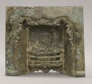 A Victorian miniature bronze salesman sample fireplace. 21 cm wide.