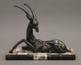 An Art Deco silvered model of an antelope on a marble base. 27 cm long.