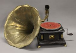 A gramophone with a brass horn. 38 cm wide.
