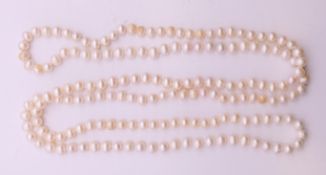 A pearl bead necklace. 126 cm long.