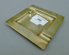 A silver ash tray. 10 cm wide. 65.6 grammes.