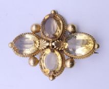 An antique unmarked gold citrine brooch (testing as 18 ct gold). 5 cm x 4 cm. 13.