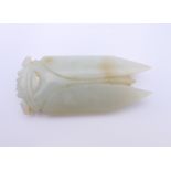 A Chinese light green jade cicada, Han Dynasty. 7 cm long. Provenance: The Larkin/Minney Collection.