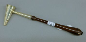 A silver mounted candle snuffer. 23.5 cm long.