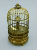 A birdcage clock. 15 cm high.