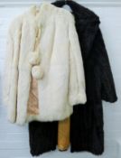 A cream fur cape and a dark brown Mini Barmink faux fur coat (Modacrylic).