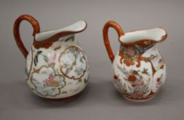 Two late 19th century Japanese Kutani jugs. The largest 13 cm high.