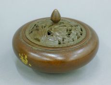 A gold splash bronze censer. 10.5 cm diameter.