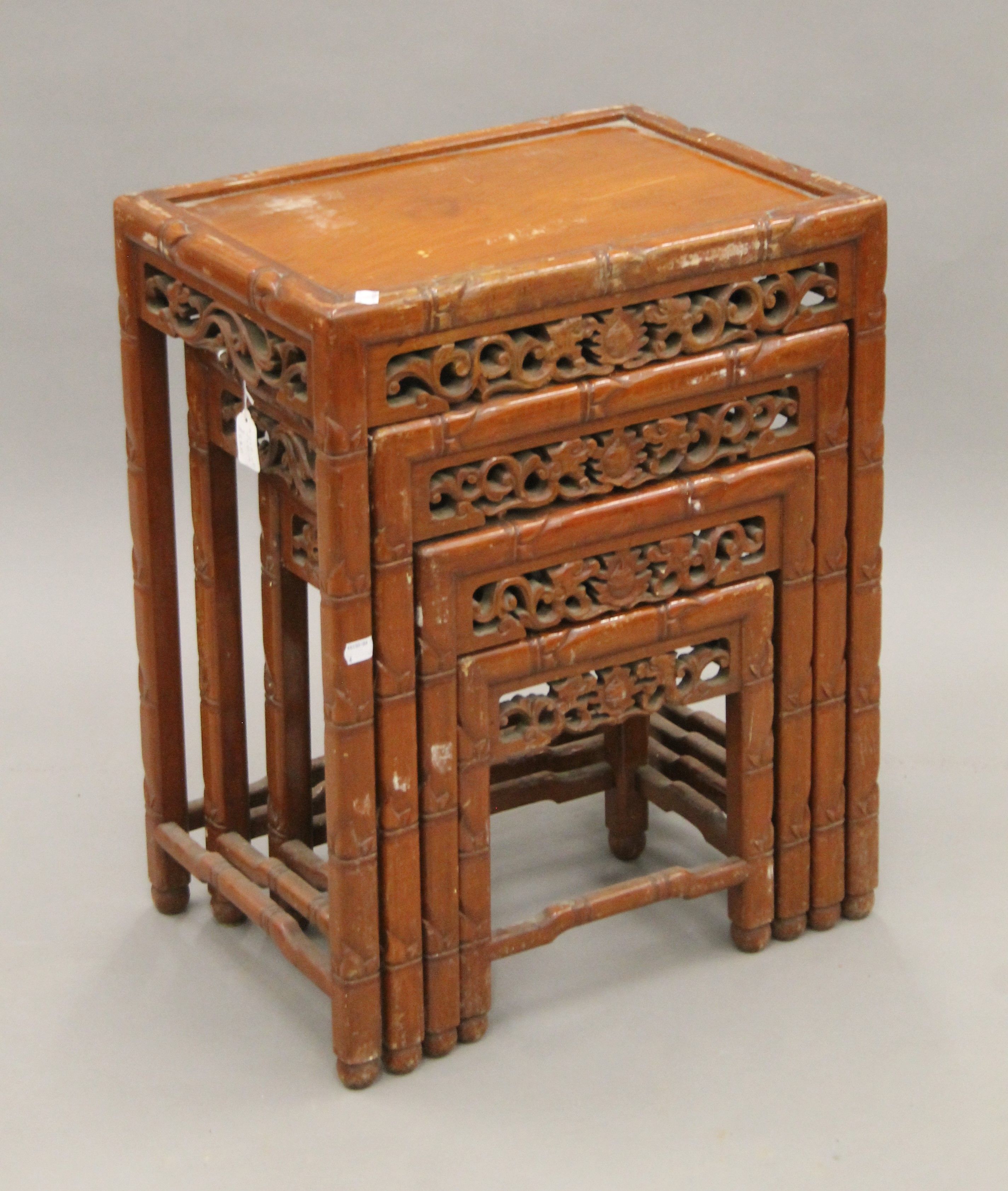 A nest of four Chinese tables. The largest 50 cm wide.