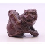 A carving of dogs-of-fo. 3.5 cm high.