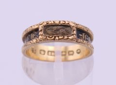 A Victorian 18 ct gold, enamel and hair plait set mourning ring. Ring size K/L.