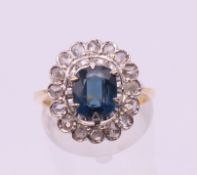 An unmarked gold sapphire and rose diamond cluster ring. Ring size M/N. 5.2 grammes total weight.