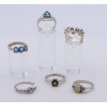Six silver gem/stone set rings.